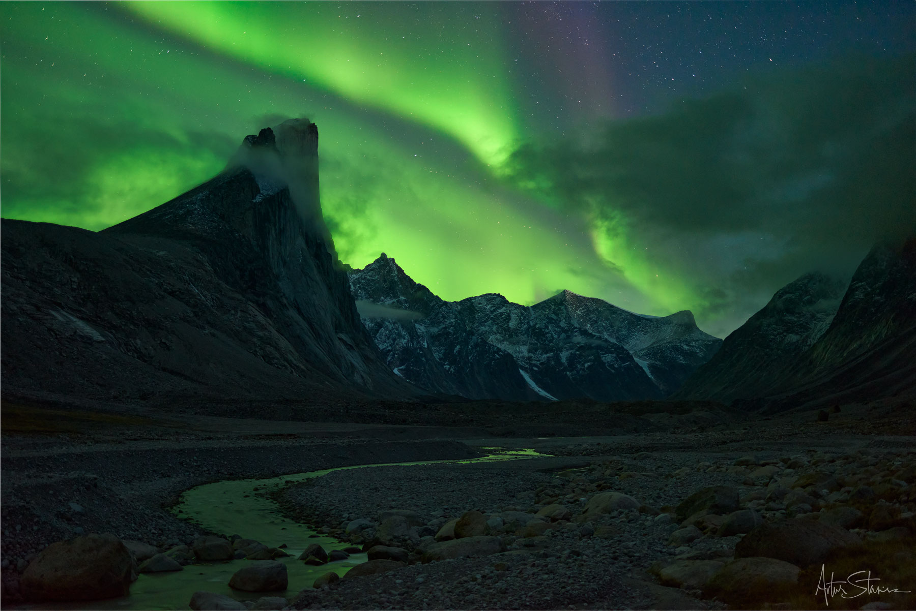 Aurora Borealis over Mount Thor on Baffin Island in Canadian Arctic.