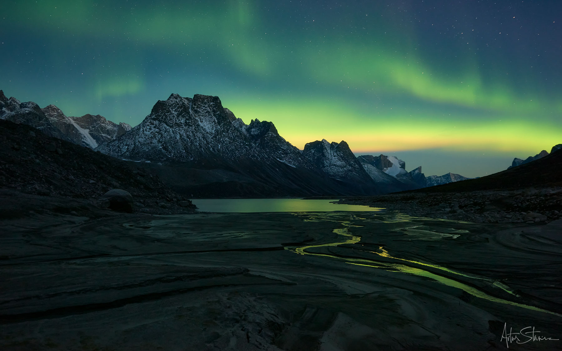 Aurora Borealis over the mountains in Canadian Arctic